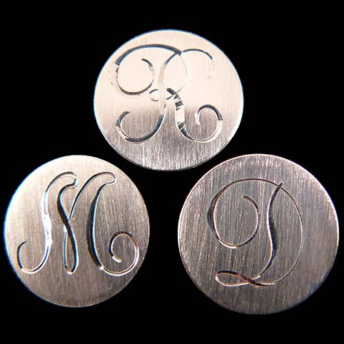 Engraving Showing Letters R, M, And D Using Bright Cut Upright Script Engraving Style