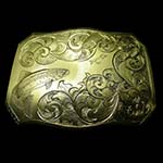 Belt Buckle Engraved With A Fish Swimming Against Waves